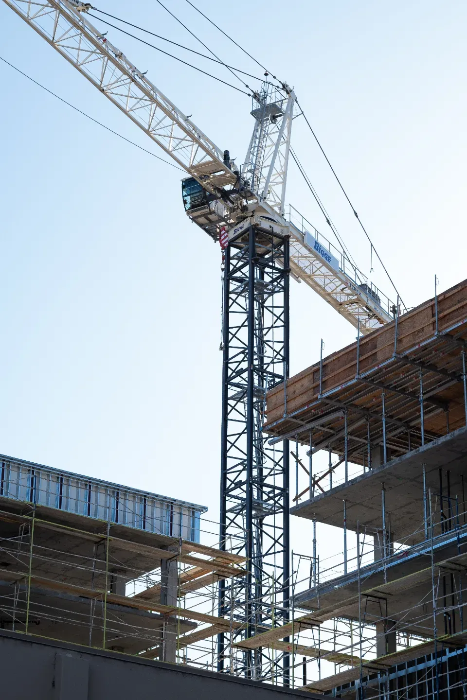 Construction crane above a building under construction
