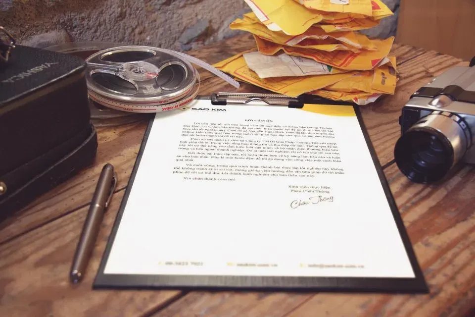 Signed letter on a clipboard on a desk
